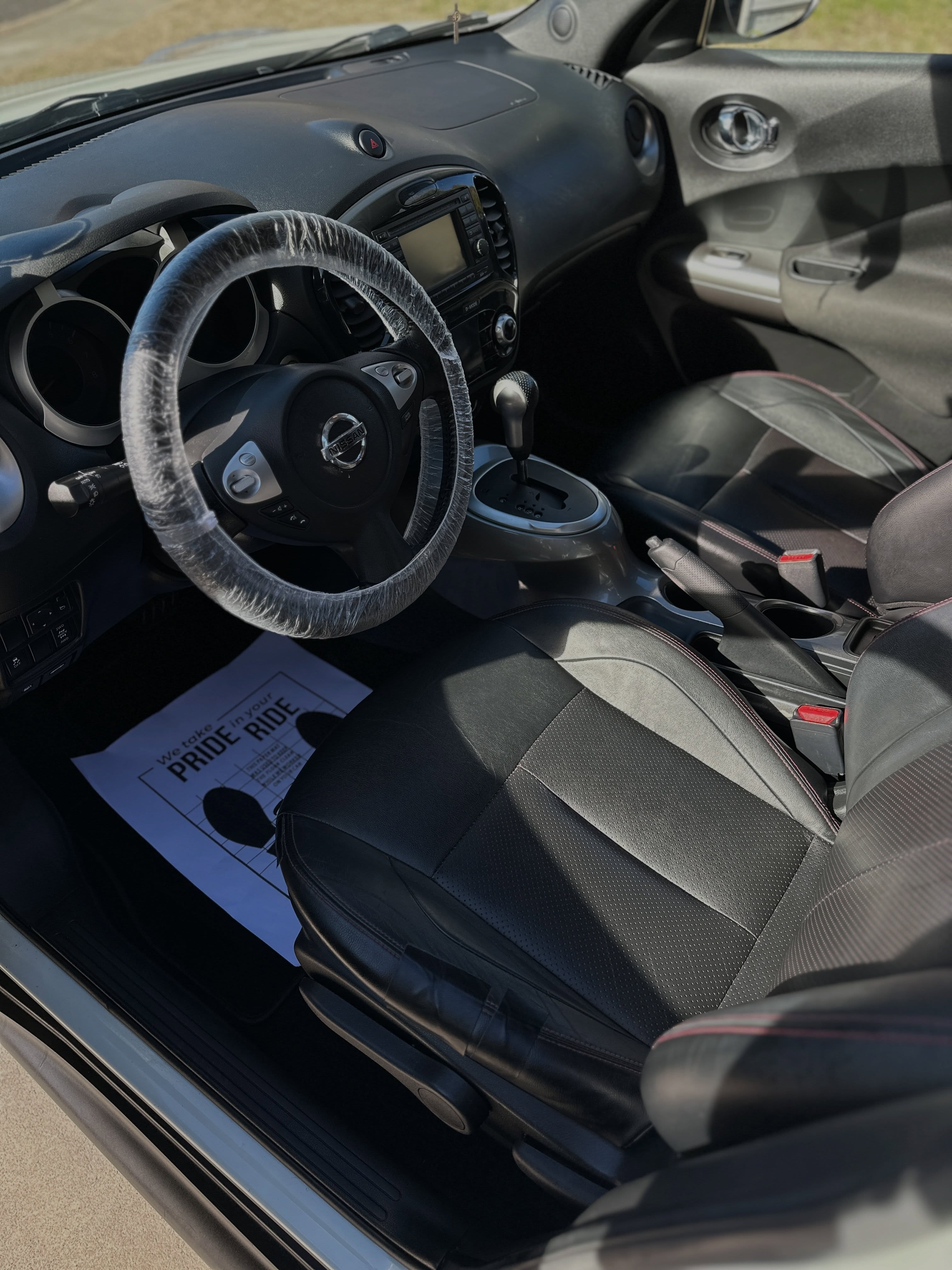 Nissan interior detailed with a steering wheel cover during the job